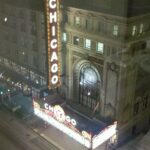Chicago Theatre marquee glowing at night on State Street