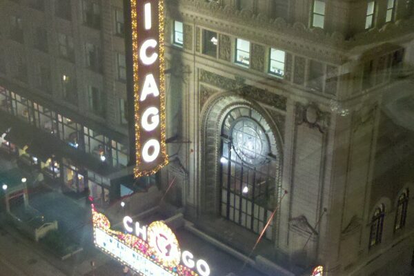 Chicago Theatre marquee glowing at night on State Street
