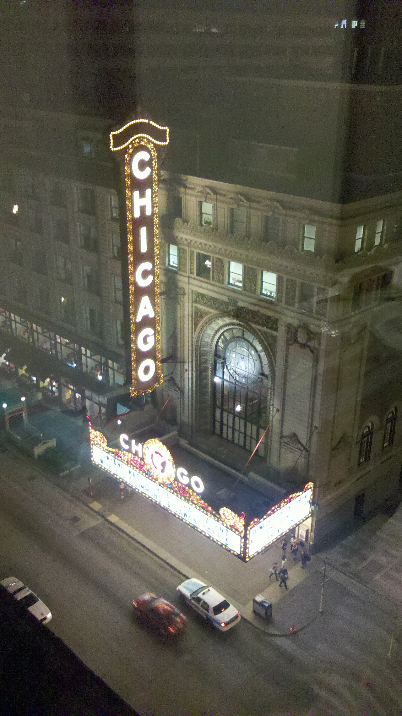 Chicago Theatre marquee glowing at night on State Street