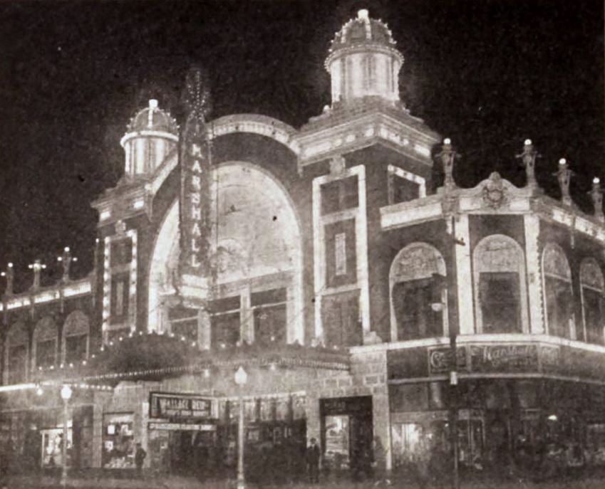 Night photograph of Marshall Square Theater in Chicago showing a 1920 film marquee
