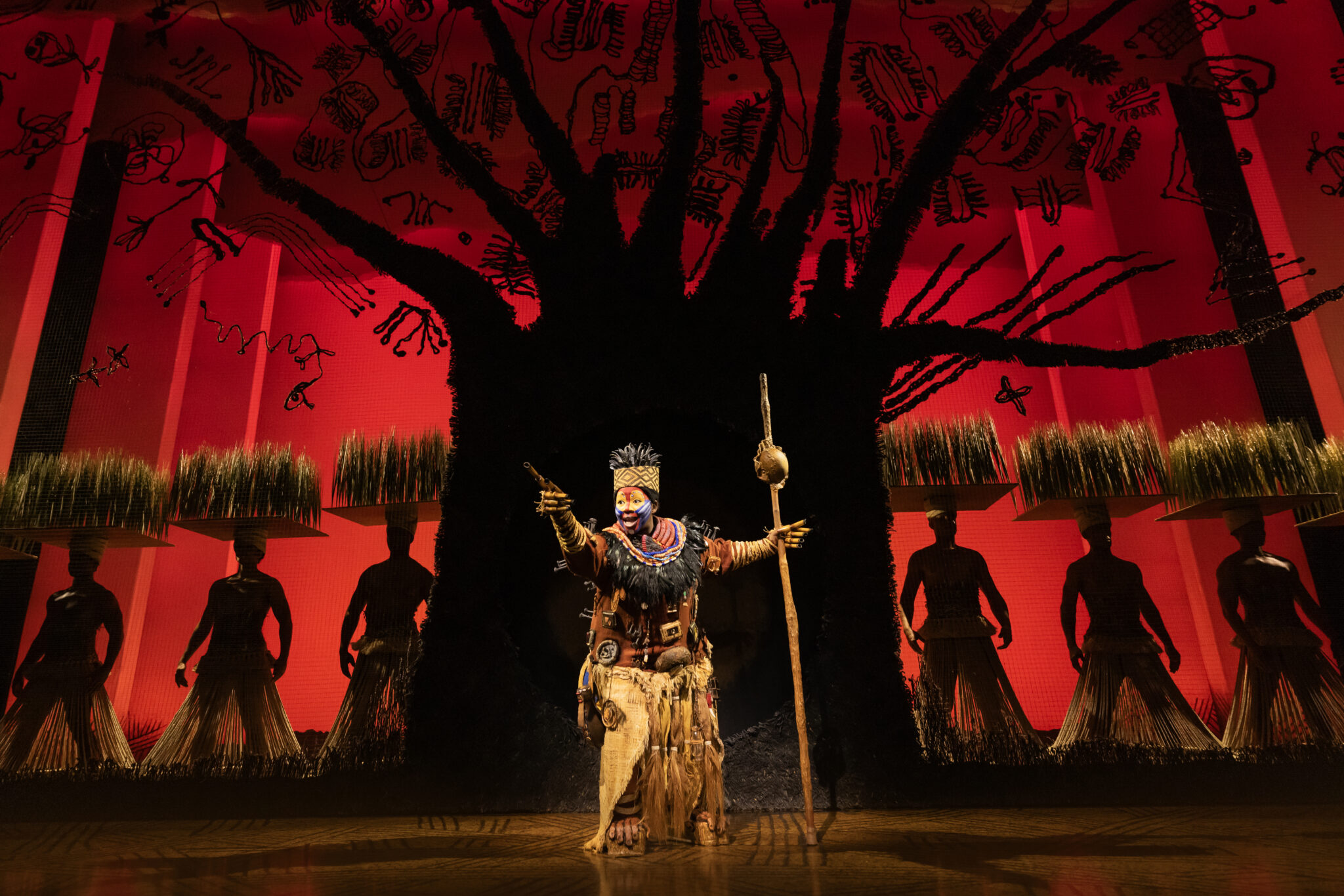 Ntsepa Pitjeng-Molebatsi as Rafiki and company in The Lion King on Broadway