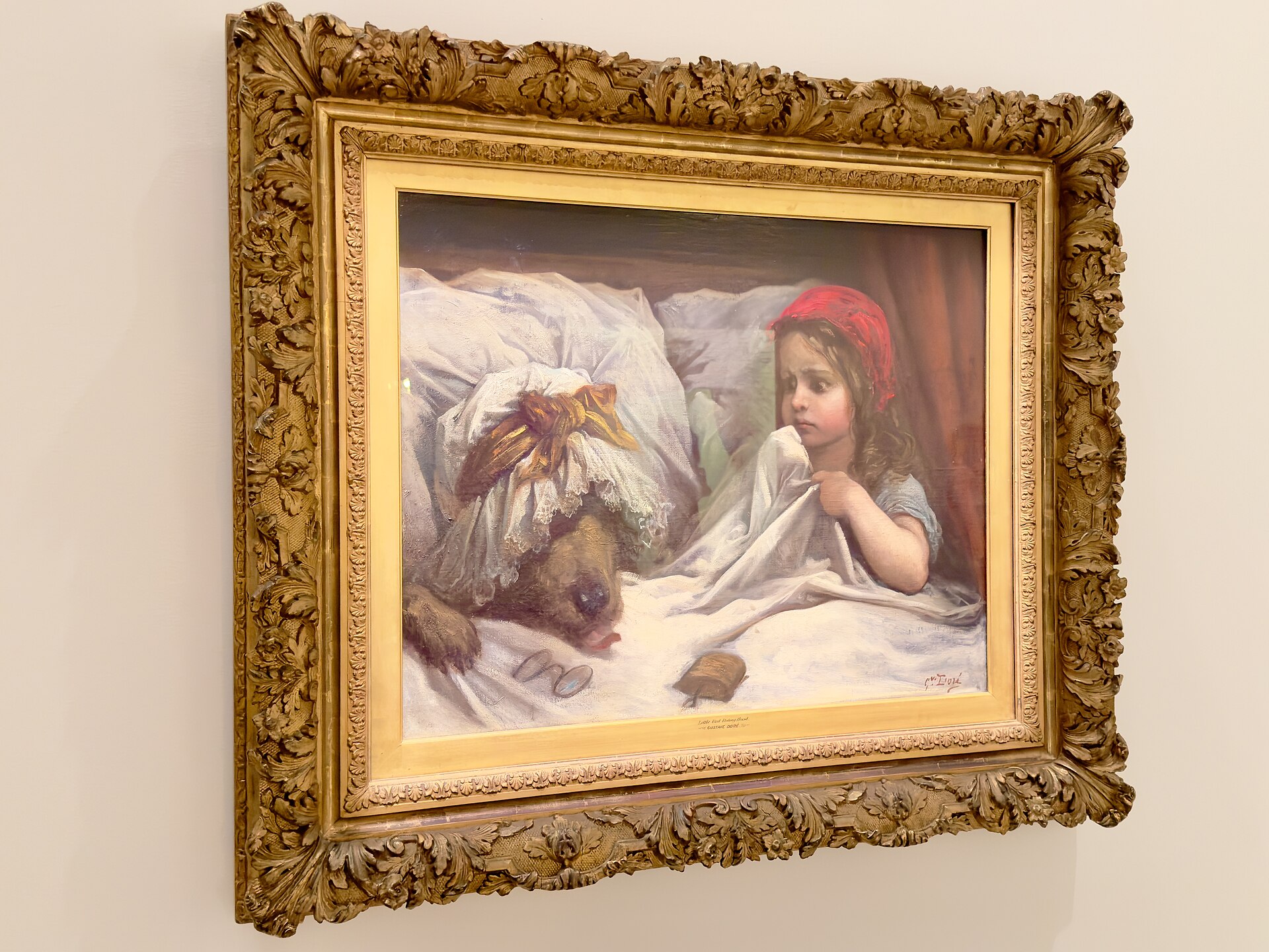 Gustave Doré painting of Little Red Riding Hood in bed beside the wolf disguised as her grandmother