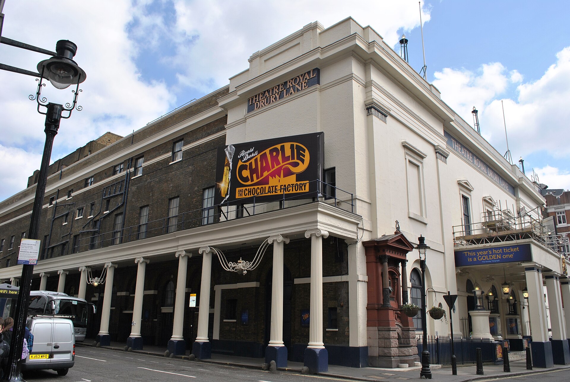 The colonnaded facade of the Theatre Royal, Drury Lane in London on a sunny day